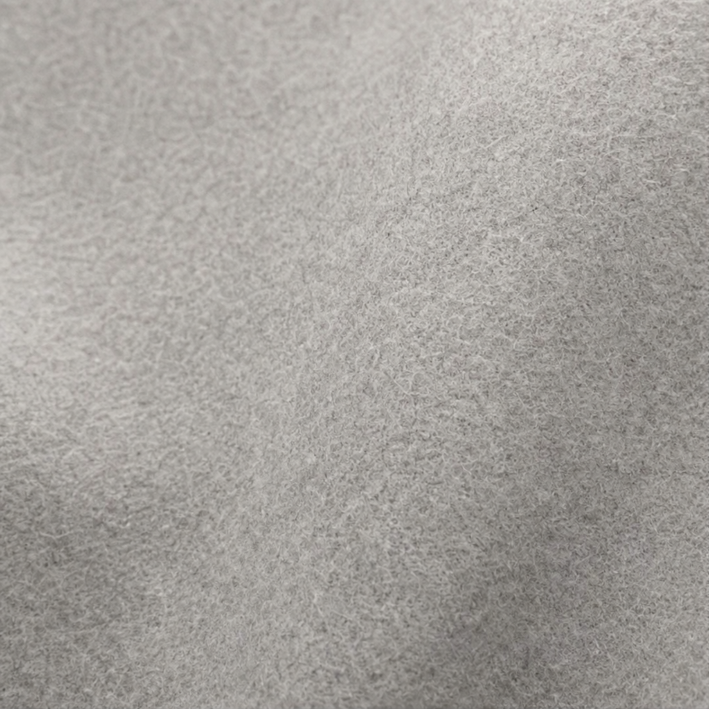 Primer plano de la superficie gris claro de la capa chaqueta.