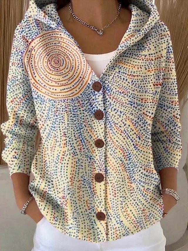 Cárdigan con capucha y botones, decorado con un estampado de puntos multicolores que forma espirales y ondas.