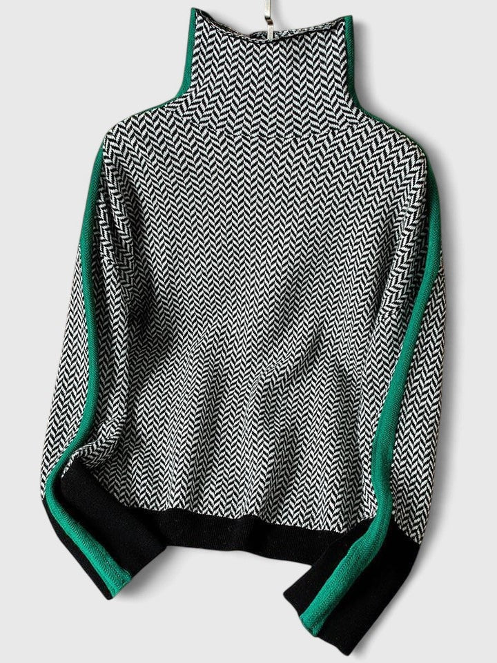 Jersey extendido sobre fondo claro, con estampado de espiga, cuello alto y rayas verdes en contraste en las mangas y los hombros.