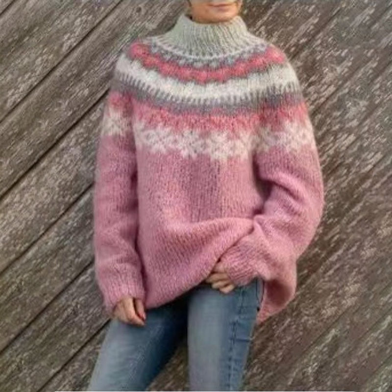 Jersey rosa de invierno con cuello redondo y franjas nórdicas blancas y fucsias sobre el pecho.
