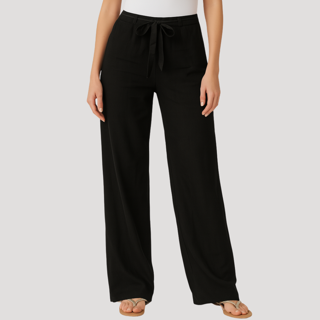 Pantalón recto negro de tiro alto, con perneras fluidas y cordón largo anudado en la cintura.
