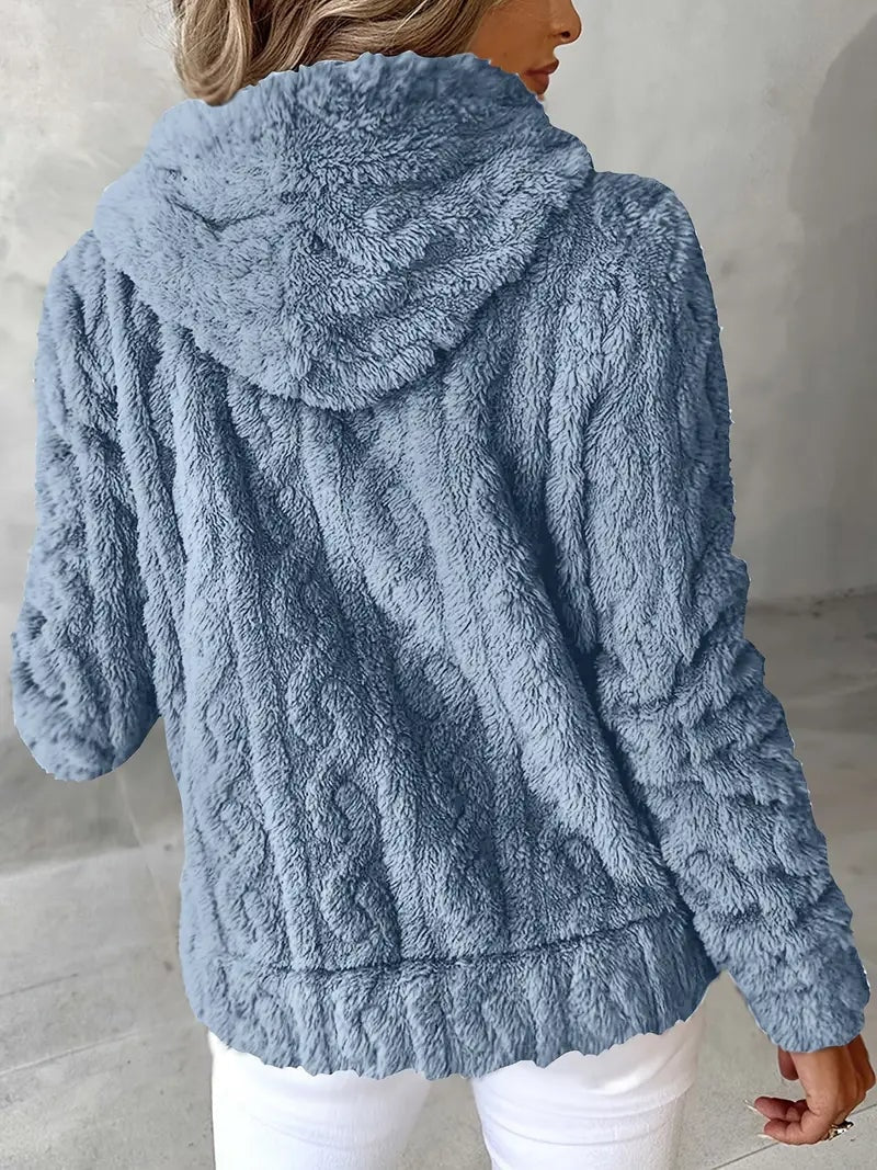 Sudadera azul grisáceo mostrada por detrás, con capucha amplia y mangas largas.
