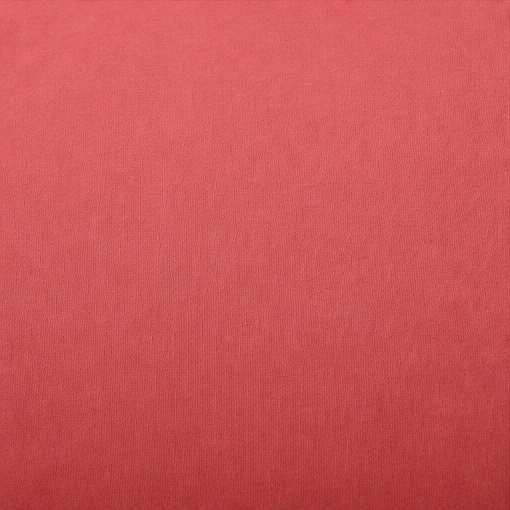 Primer plano de la superficie lisa y el color coral de la sudadera.