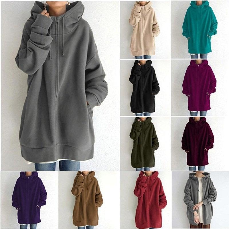 Composición con la sudadera oversize con capucha y cremallera en varios colores, incluidos gris, beige, turquesa, negro, fucsia, verde, morado, marrón y rojo.