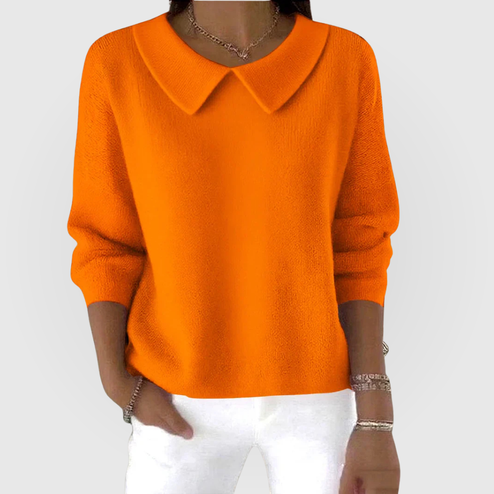 Suéter naranja de manga larga con cuello camisero, bajo recto y volumen relajado.