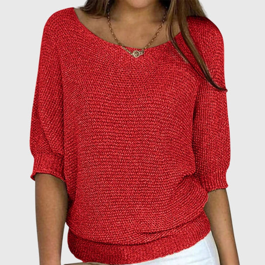 Suéter holgado rojo de escote amplio y mangas tres cuartos con puños y cintura acanalados.